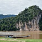 Trees on Rocky Cliff Beside River